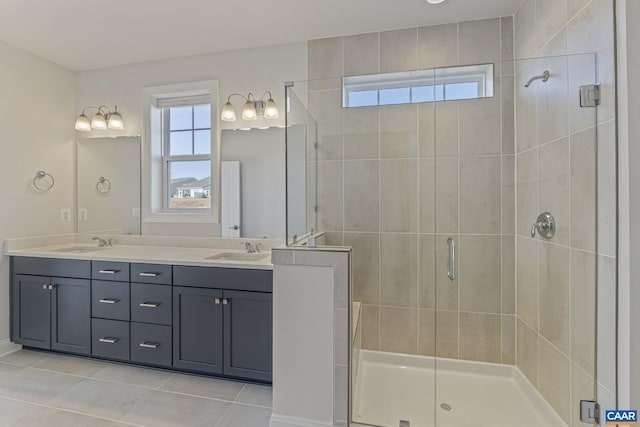 bathroom featuring vanity, tile patterned floors, and walk in shower