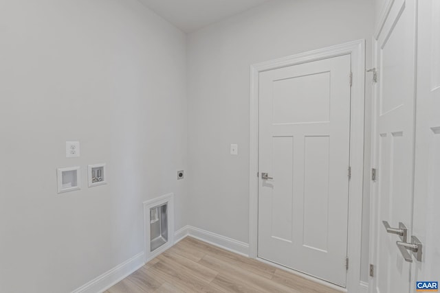 laundry area featuring hookup for an electric dryer, hookup for a washing machine, and light hardwood / wood-style floors