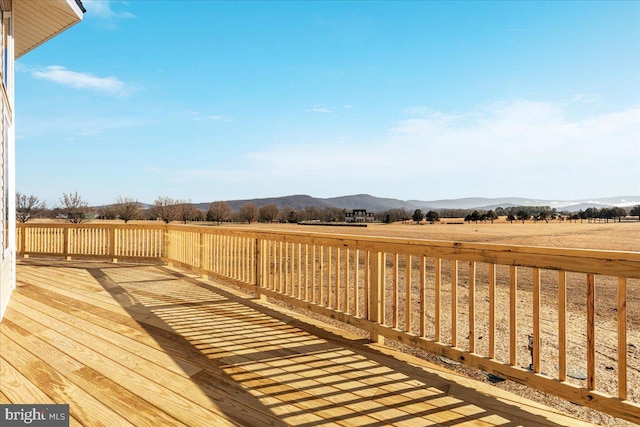 wooden deck featuring a mountain view