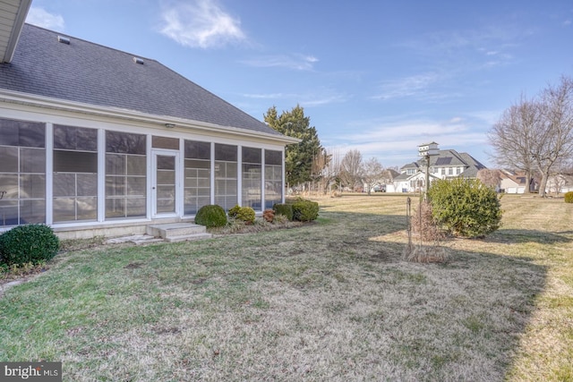 view of yard with a sunroom