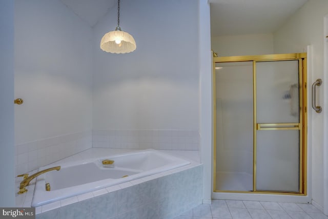 bathroom featuring tile patterned floors and shower with separate bathtub