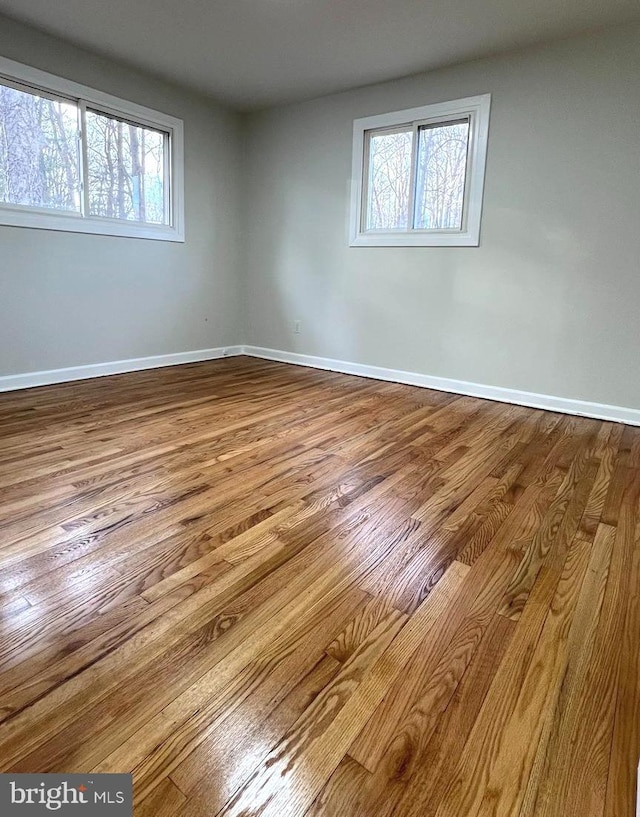 spare room with light wood-type flooring