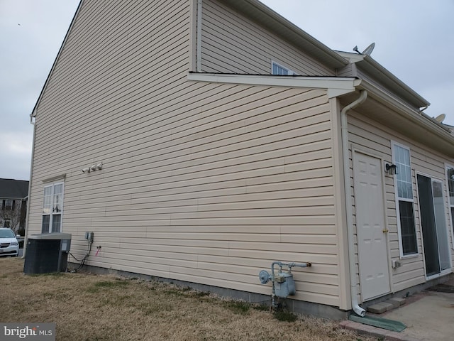 view of side of property with cooling unit