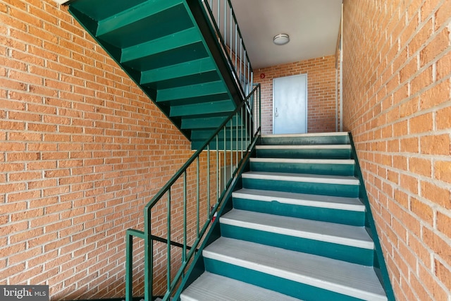 stairway with brick wall