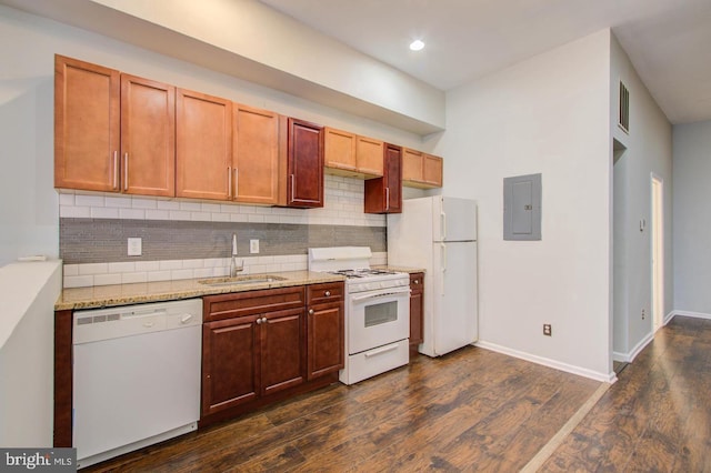 kitchen featuring sink, white appliances, electric panel, light stone counters, and dark hardwood / wood-style flooring