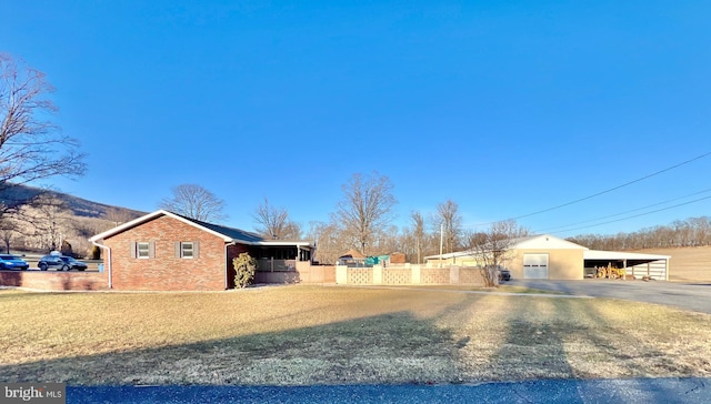 exterior space featuring a lawn and a carport