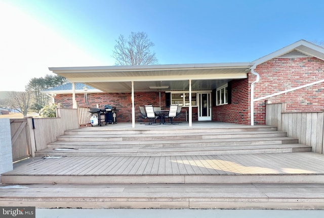 wooden deck with grilling area