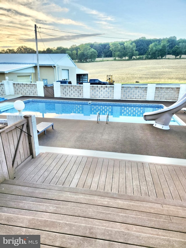 view of pool featuring a water slide