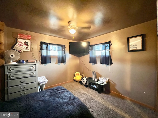 bedroom with ceiling fan, carpet, and multiple windows