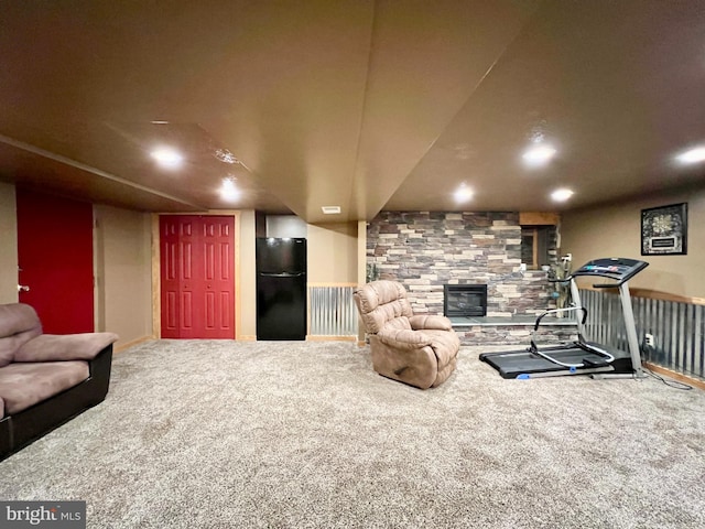 interior space featuring a fireplace and carpet