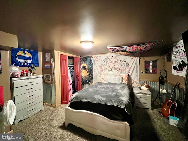 bedroom with carpet and a closet