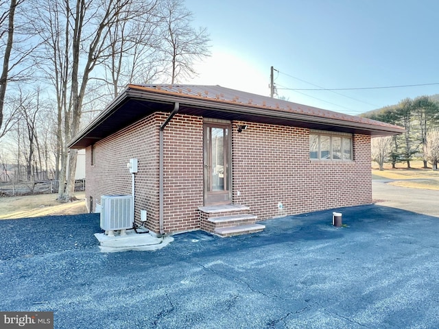 view of property exterior featuring central AC unit