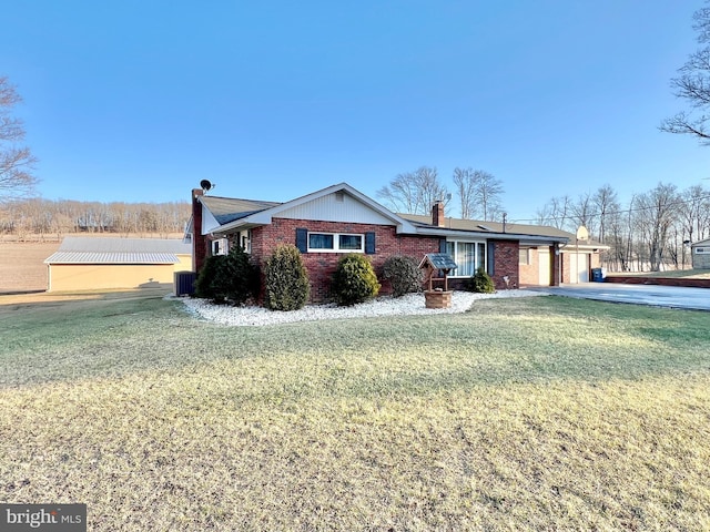 single story home with a garage and a front yard