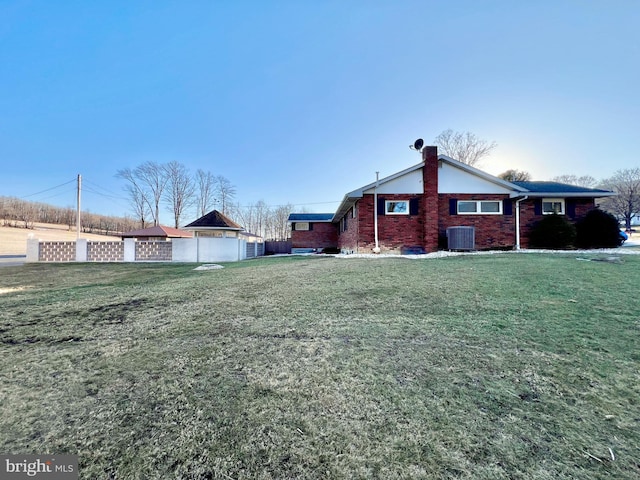 view of yard with a garage and central air condition unit