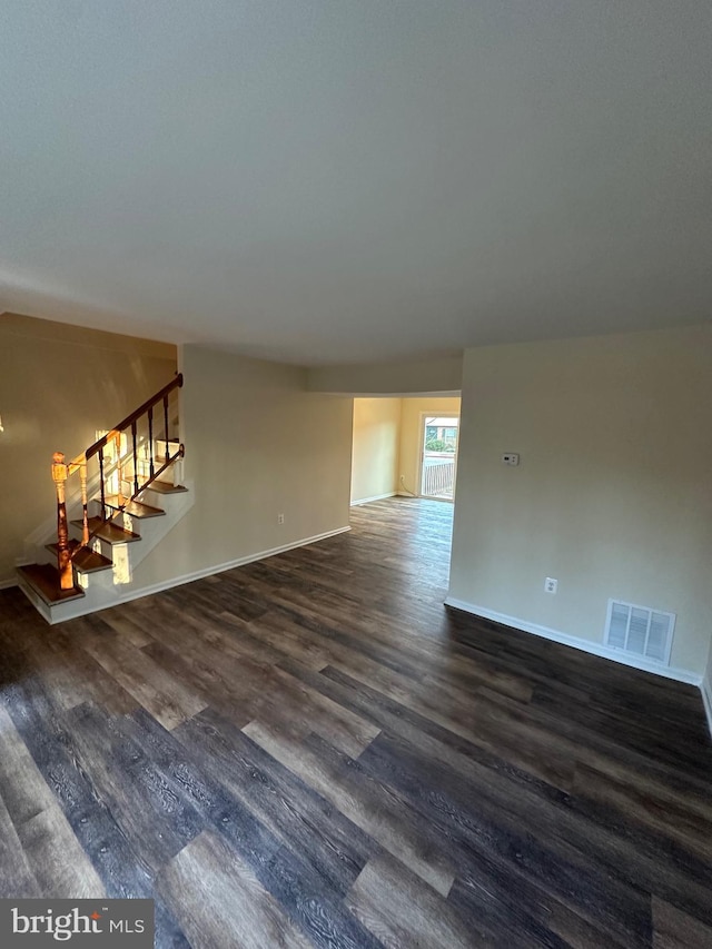 unfurnished room featuring dark hardwood / wood-style flooring