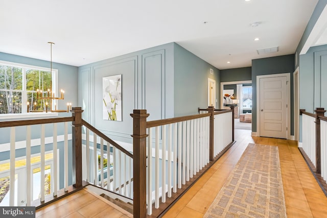 15700 Bennington Farms Ln, Brandywine, MD 20613 - corridor with a wealth of natural light and a chandelier