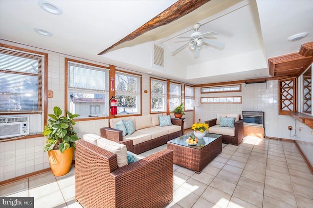 living room featuring cooling unit, tile walls, vaulted ceiling with beams, ceiling fan, and light tile patterned floors