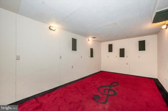 basement featuring carpet flooring