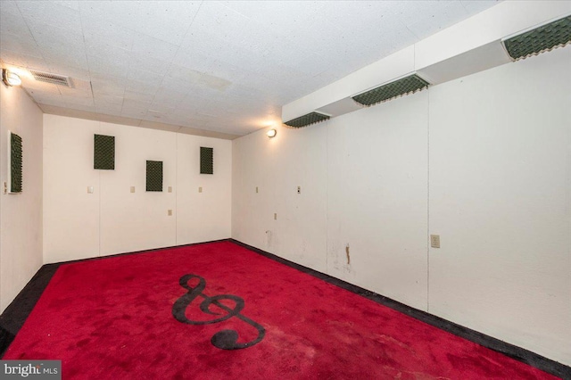 basement featuring carpet flooring