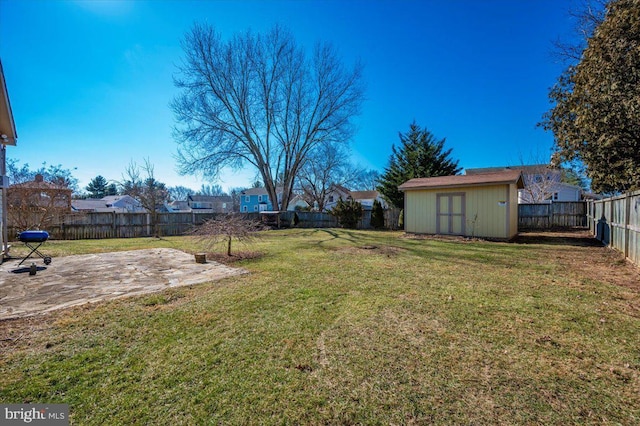 view of yard with a shed and a patio