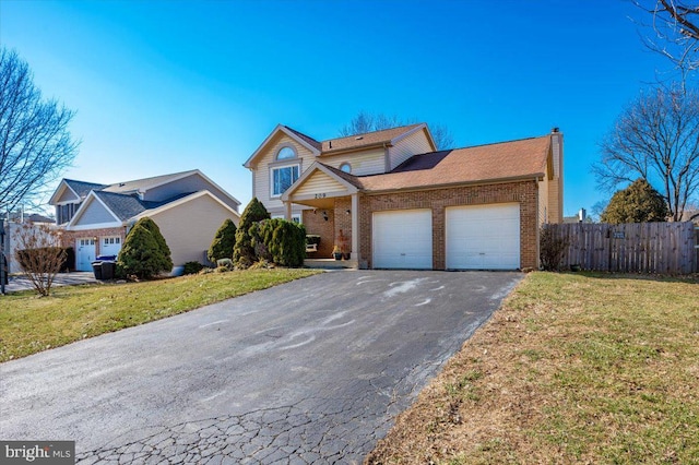 front of property with a garage and a front yard