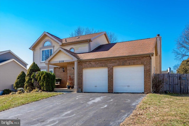 front of property featuring a garage and a front yard