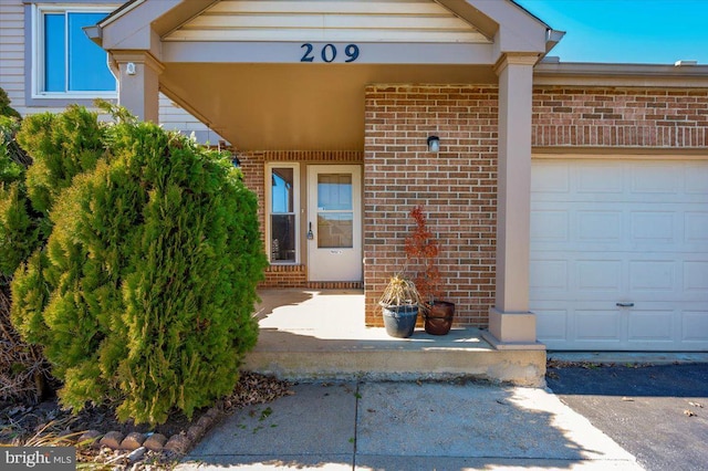 view of exterior entry featuring a garage