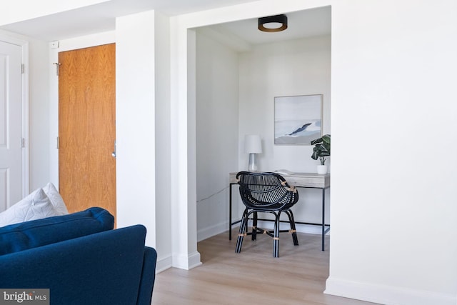 office with light hardwood / wood-style flooring