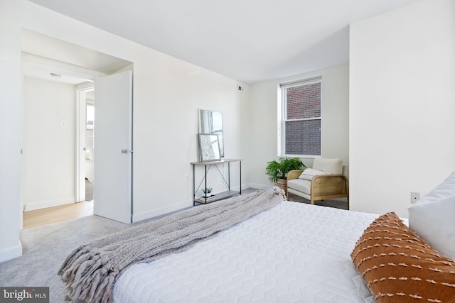 bedroom with light carpet