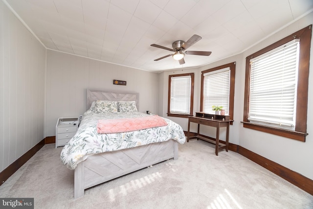 bedroom with light colored carpet and ceiling fan