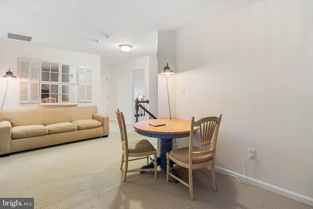 view of carpeted dining area