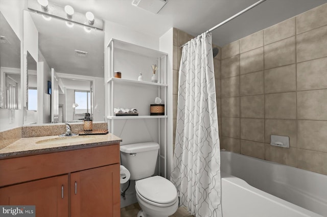 full bathroom with vanity, shower / bath combination with curtain, and toilet