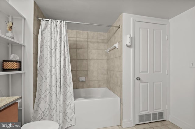 bathroom with vanity, shower / tub combo with curtain, and tile patterned floors