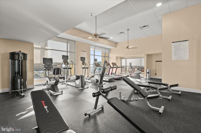 workout area featuring a drop ceiling and ceiling fan