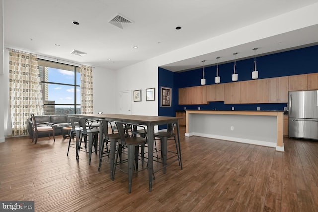 dining room with dark hardwood / wood-style floors