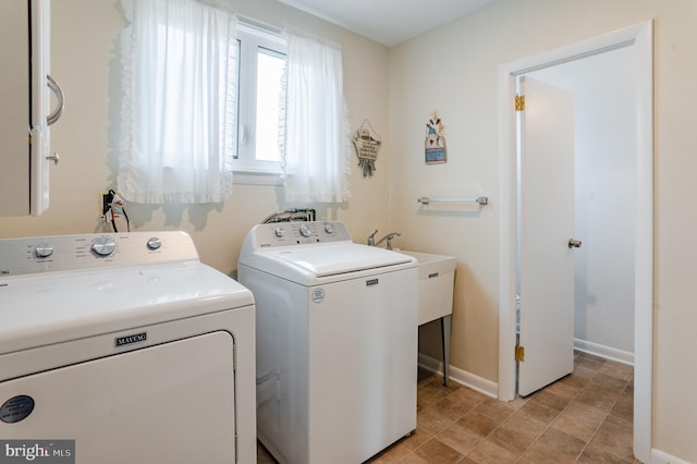 laundry area featuring sink and washer and dryer