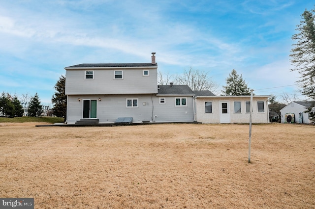 back of house with a yard