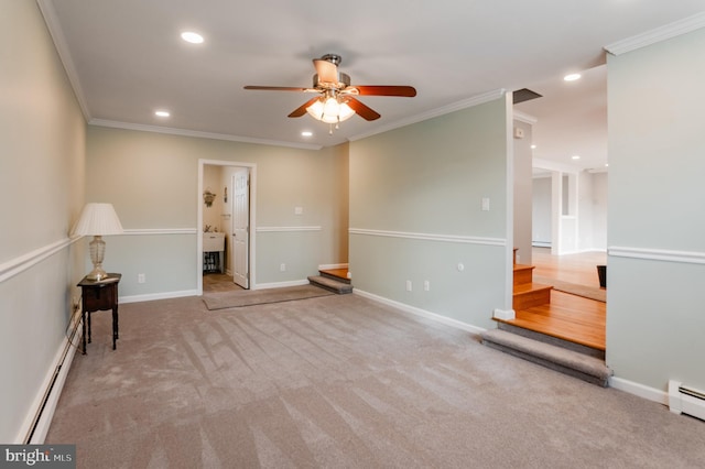 carpeted spare room featuring a baseboard heating unit, ornamental molding, and ceiling fan