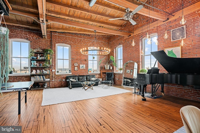 miscellaneous room featuring hardwood / wood-style flooring, brick wall, beam ceiling, and wooden ceiling