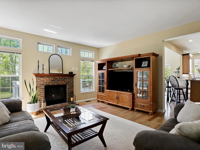 6852 Fielding Ct, Frederick, MD 21703 - living area with a fireplace, light wood-style flooring, recessed lighting, baseboards, and visible vents