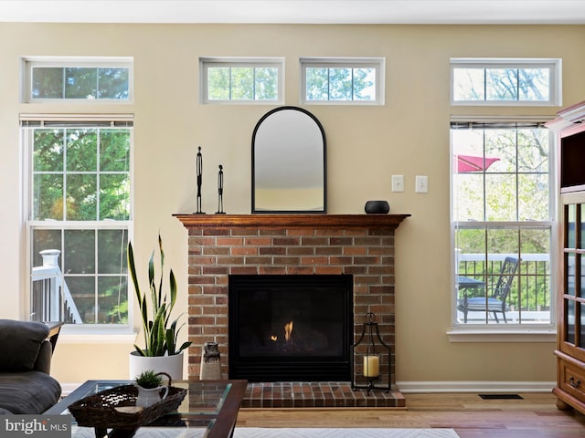 6852 Fielding Ct, Frederick, MD 21703 - room details with baseboards, visible vents, wood finished floors, and a fireplace