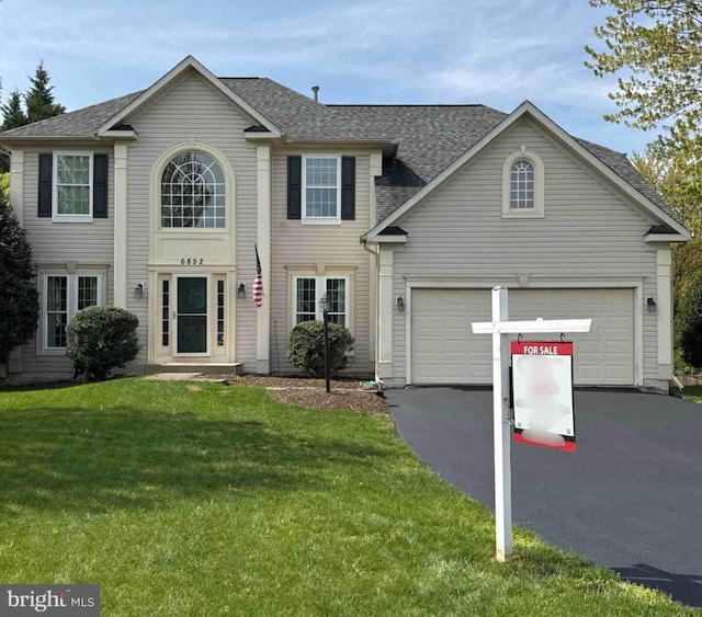 6852 Fielding Ct, Frederick, MD 21703 - colonial inspired home featuring a front lawn, roof with shingles, and driveway