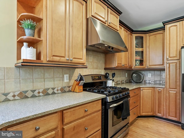 6852 Fielding Ct, Frederick, MD 21703 - kitchen featuring light stone countertops, open shelves, stainless steel gas stove, light wood-style floors, and under cabinet range hood