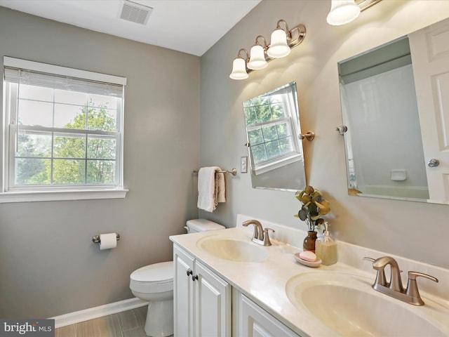 6852 Fielding Ct, Frederick, MD 21703 - full bathroom with double vanity, toilet, visible vents, and a sink