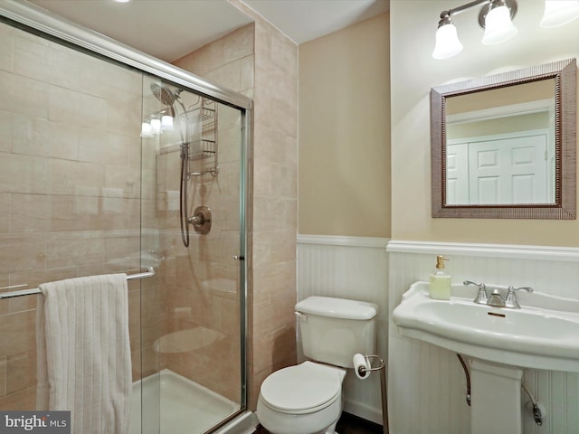 6852 Fielding Ct, Frederick, MD 21703 - bathroom with wainscoting, toilet, and a shower stall