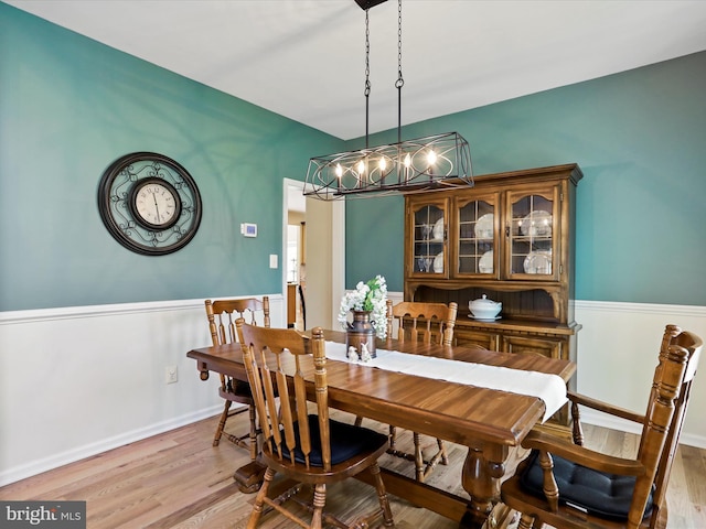 6852 Fielding Ct, Frederick, MD 21703 - dining area featuring light wood-style floors, baseboards, and a chandelier