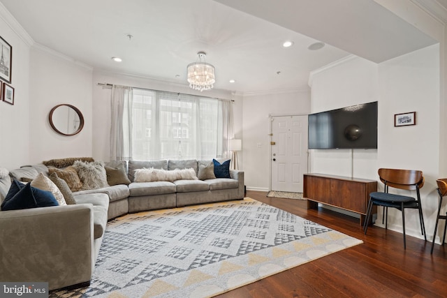 living room featuring crown molding, dark hardwood / wood-style floors, and a notable chandelier