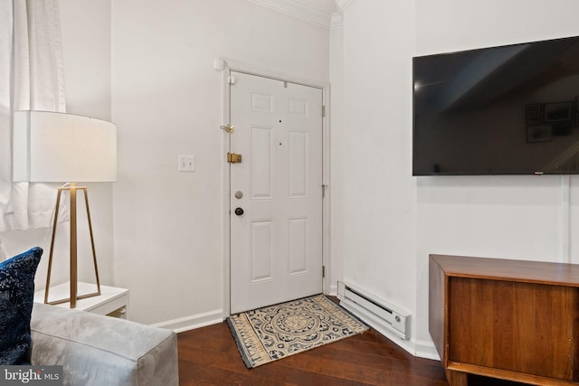 foyer with crown molding, dark wood-type flooring, and baseboard heating