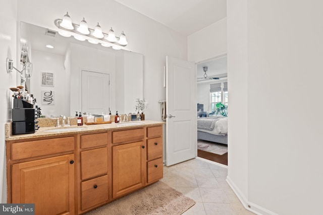 bathroom featuring tile patterned flooring and vanity