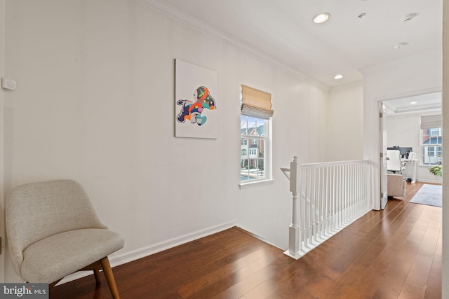 corridor with dark wood-type flooring and ornamental molding